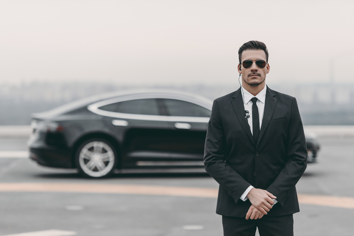 AdobeStock_183488255-Guard-with-Tesla